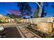 Landscaped backyard featuring a water feature and stone pathway at 2423 E Marshall Ave, Phoenix, AZ 85016