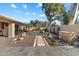 Landscaped backyard with a tranquil water feature at 2423 E Marshall Ave, Phoenix, AZ 85016