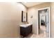 Small bathroom with a single sink and view of hallway at 2423 E Marshall Ave, Phoenix, AZ 85016