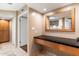 Modern bathroom with a floating vanity and large mirror at 2423 E Marshall Ave, Phoenix, AZ 85016