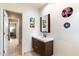 Simple bathroom with floating vanity and colorful wall art at 2423 E Marshall Ave, Phoenix, AZ 85016