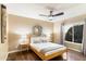 Serene bedroom with wood floors and large circular mirror at 2423 E Marshall Ave, Phoenix, AZ 85016