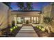 Landscaped courtyard with a stone fountain, lighting, and seating area at 2423 E Marshall Ave, Phoenix, AZ 85016