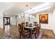 Bright dining room with hardwood floors and modern light fixtures at 2423 E Marshall Ave, Phoenix, AZ 85016