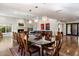 Open dining area with hardwood floors and view into living room at 2423 E Marshall Ave, Phoenix, AZ 85016