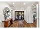 Bright entryway with hardwood floors and large mirror at 2423 E Marshall Ave, Phoenix, AZ 85016