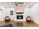 Living room featuring hardwood floors, fireplace, and stylish seating at 2423 E Marshall Ave, Phoenix, AZ 85016