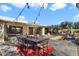 Outdoor dining patio with red rug and string lights at 2423 E Marshall Ave, Phoenix, AZ 85016