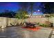 Stone patio with dining set and serene garden accents at 2423 E Marshall Ave, Phoenix, AZ 85016