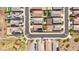 An aerial view shows many homes in a well-planned residential neighborhood with green spaces and desert landscaping at 25969 W Tina Ln, Buckeye, AZ 85396