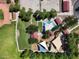 Bird's eye view of community park with playgrounds, splash pad, and sports courts offers recreation at 25969 W Tina Ln, Buckeye, AZ 85396