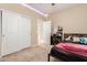 Bright bedroom with double door closet and built-in vanity at 25969 W Tina Ln, Buckeye, AZ 85396