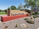 Welcoming Festival Foothills community sign with desert landscaping and vibrant surroundings at 25969 W Tina Ln, Buckeye, AZ 85396