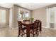 Dining area with a dark wood table and six chairs at 25969 W Tina Ln, Buckeye, AZ 85396