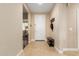 Interior entryway with tile flooring, bench, and coat rack at 25969 W Tina Ln, Buckeye, AZ 85396