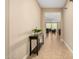 Bright hallway with tile floors, leading to the living room at 25969 W Tina Ln, Buckeye, AZ 85396