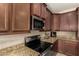 Well-equipped kitchen with granite counters and stainless steel appliances at 25969 W Tina Ln, Buckeye, AZ 85396