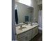 Double vanity bathroom with large mirror at 26035 W Quail Ave, Buckeye, AZ 85396