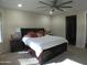 Spacious main bedroom with plush bed, nightstands, and ample natural light at 26035 W Quail Ave, Buckeye, AZ 85396