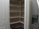 Walk-in pantry with ample shelving for storage at 26035 W Quail Ave, Buckeye, AZ 85396