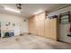 Garage with ample built-in storage cabinets and flooring at 26541 W Ross Ave, Buckeye, AZ 85396