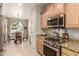 Kitchen with stainless steel appliances and granite countertops at 26541 W Ross Ave, Buckeye, AZ 85396