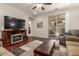 Living room with fireplace, hardwood floors, and sliding glass door at 26541 W Ross Ave, Buckeye, AZ 85396