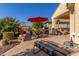 Large backyard patio with lounge chair and seating area at 26541 W Ross Ave, Buckeye, AZ 85396