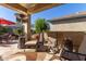 Outdoor patio with seating, heater, and umbrella at 26541 W Ross Ave, Buckeye, AZ 85396