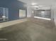 Spacious garage with open door and mirrored walls at 2708 N Heritage St, Buckeye, AZ 85396