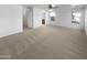 Main bedroom with carpet, door to bathroom, and window at 2708 N Heritage St, Buckeye, AZ 85396