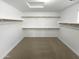 Large walk-in closet with shelves and hanging rods at 2708 N Heritage St, Buckeye, AZ 85396