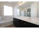 Bathroom with double vanity and large mirror at 27194 N Skipping Rock Rd, Peoria, AZ 85383