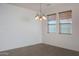 Dining room with chandelier and large windows at 27194 N Skipping Rock Rd, Peoria, AZ 85383