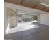 Attached garage with open door revealing a view of the neighborhood at 27194 N Skipping Rock Rd, Peoria, AZ 85383