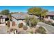 Single-story home with desert landscaping and a private driveway at 30994 N 74Th Way, Scottsdale, AZ 85266