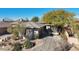 Single-story home with tile roof, neutral color scheme, and mature desert landscaping at 30994 N 74Th Way, Scottsdale, AZ 85266