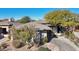 Single-story home with tile roof, neutral color scheme, and mature desert landscaping at 30994 N 74Th Way, Scottsdale, AZ 85266