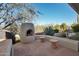 Landscaped backyard with flagstone patio and fire pit at 30994 N 74Th Way, Scottsdale, AZ 85266