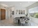 Open dining area with a large window and modern table at 30994 N 74Th Way, Scottsdale, AZ 85266