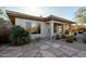 Rear exterior view of home with stone patio at 30994 N 74Th Way, Scottsdale, AZ 85266