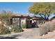 Single-story home with tile roof, neutral color scheme, and mature desert landscaping at 30994 N 74Th Way, Scottsdale, AZ 85266