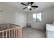 Bedroom with crib, dresser, and ceiling fan at 3496 E Anika Ct, Gilbert, AZ 85298