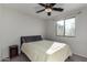 Bright bedroom with double bed, nightstand, and window at 3496 E Anika Ct, Gilbert, AZ 85298