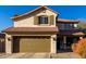 Two-story house with tan exterior, brown roof, and a two-car garage at 3496 E Anika Ct, Gilbert, AZ 85298