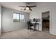 Home office with desk, computer, and built-in shelves at 3496 E Anika Ct, Gilbert, AZ 85298