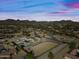 Aerial view of a large property with a home and riding arena at 37209 N 12Th St, Phoenix, AZ 85086