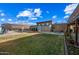 Landscaped backyard featuring a covered patio and play area at 37209 N 12Th St, Phoenix, AZ 85086