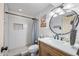 Clean bathroom with a walk-in shower and farmhouse style vanity at 37209 N 12Th St, Phoenix, AZ 85086