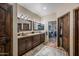 Elegant bathroom with double sinks, granite counters, and large mirrors at 37209 N 12Th St, Phoenix, AZ 85086